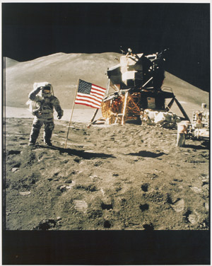 Lot 4268, Auction  113, NASA, James Irwin gives a military salute beside the U.S. flag