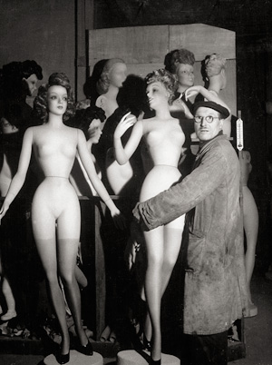 Lot 4132, Auction  120, Doisneau, Robert, Man carrying mannequins
