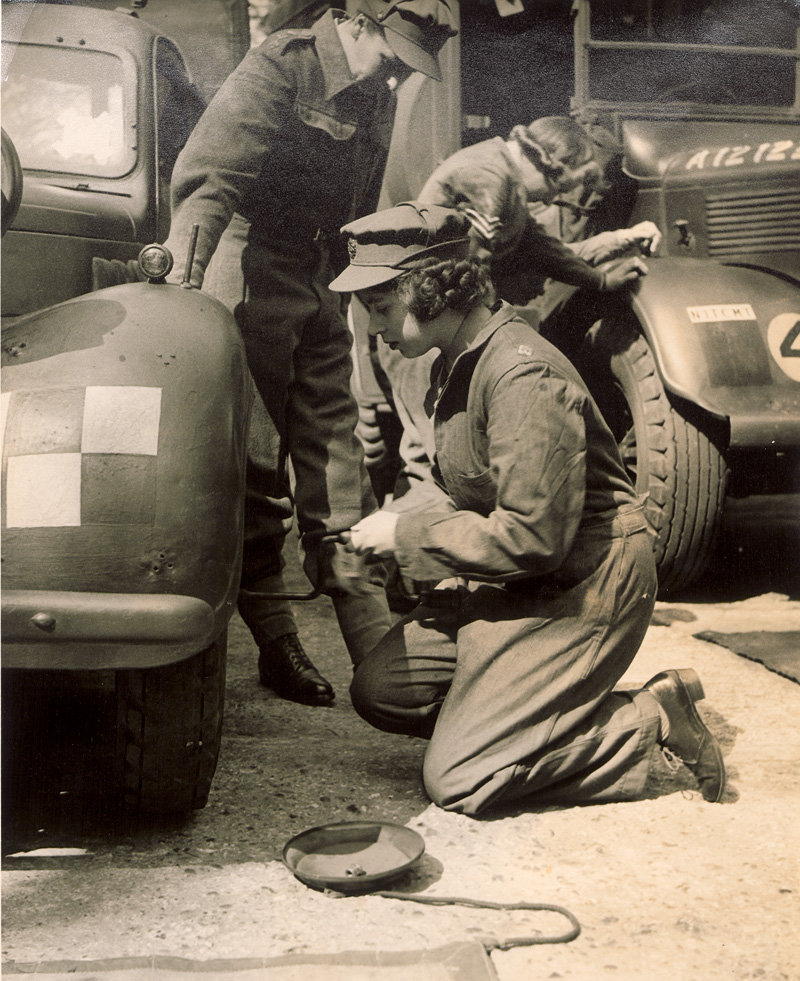 Lot 4121, Auction  124, Elizabeth II, Queen, Princess Elizabeth training as an ATS officer, learning how to change a truck wheel