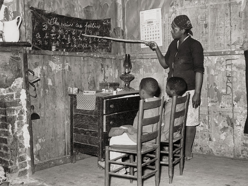 Lot 4220, Auction  124, Lee, Russell, Negro mother teaching children numbers and alphabet in home of sharecropper, Transylvania, Louisiana; Daughter of sharecroppers, New Madrid County, Missouri