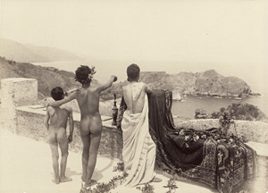 Lot 4044, Auction  126, Gloeden, Wilhelm von, Arcadian scene with a group of nude youths on terrace overlooking the sea