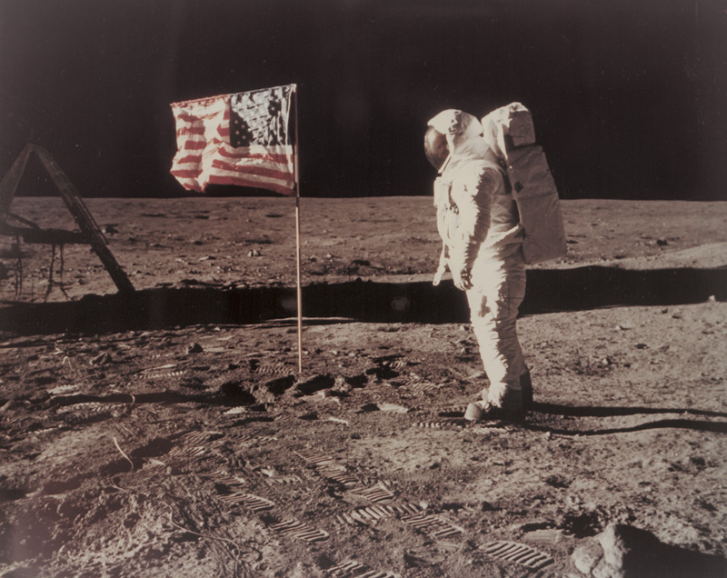 Lot 4242, Auction  127, NASA, Buzz Aldrin standing beside the U.S. flag